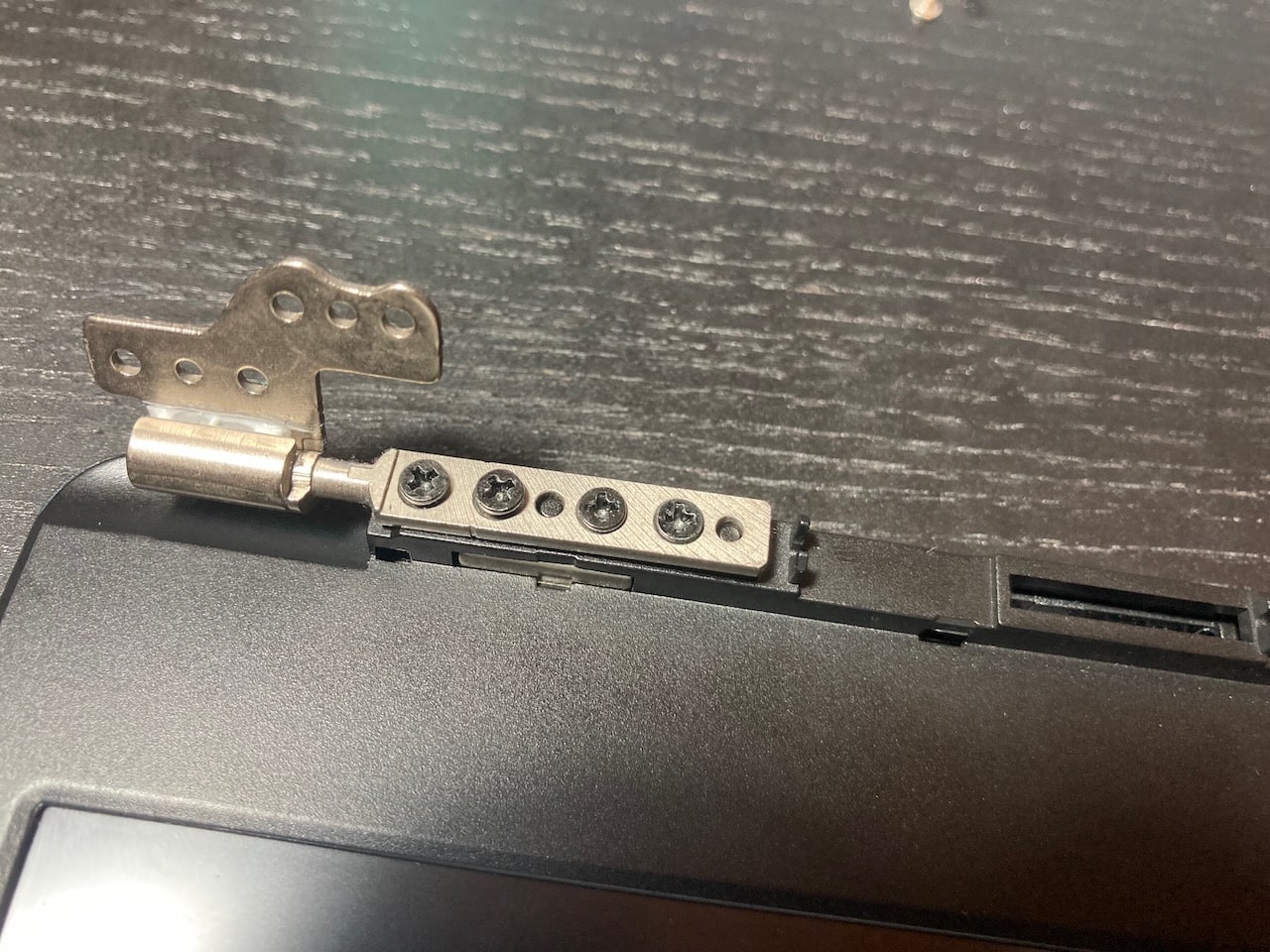 Close-up of a Pinebook Pro lid hinge