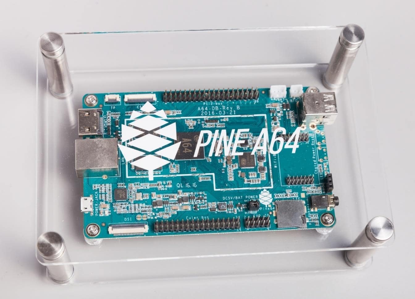A Pine A64 mounted in the "Model A" Acrylic Open Enclosure. The text on the top is "PINE64" nowadays.